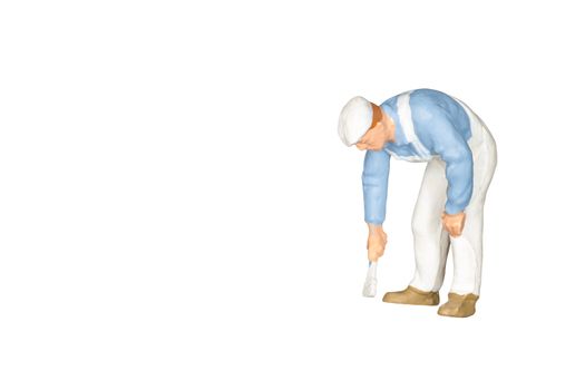 Miniature people : Painter holding a brush isolated on white and clipping path