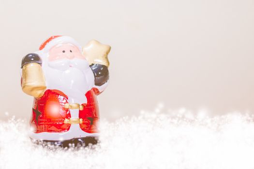 Santa Claus Holding Gold Star and Bell