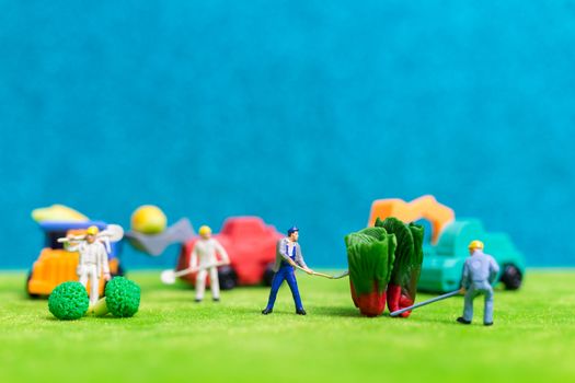 Miniature people : Farmers harvesting a vegetables , Agriculture concept