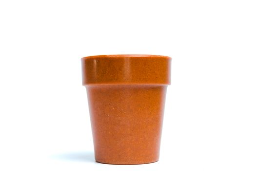 Recycled materials biodegradable tree pot isolated on a white background