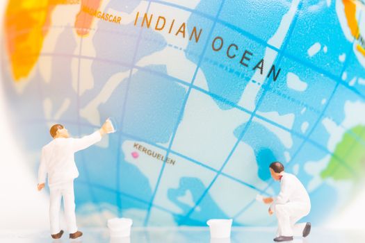 Miniature people : Painters painting on The globe , Earth day concept