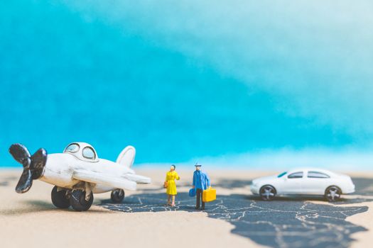 Miniature people : Travellers with airplane on The world map , Travel and business concept.