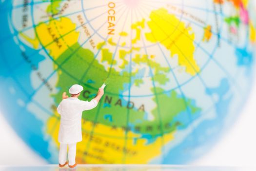 Miniature people : Painters painting on The globe , Earth day concept