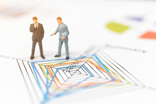 Miniature people: Businessman thinking with project for investment  , Business planning Concept.