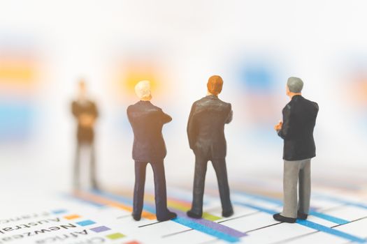 Miniature people: Businessman thinking with project for investment  , Business planning Concept.