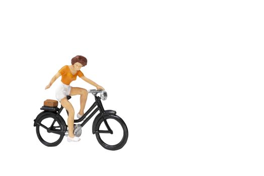 Miniature people travellers with bicycle isolate on white background with clipping path