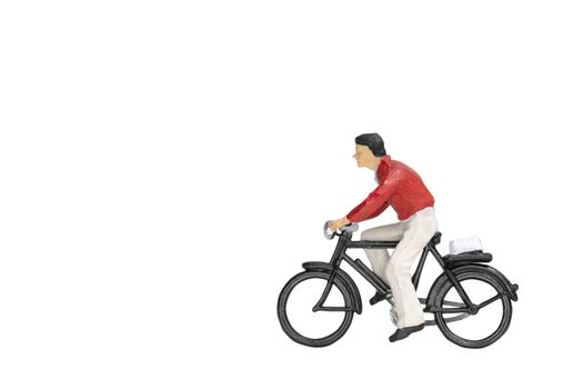 Miniature people travellers with bicycle isolate on white background with clipping path
