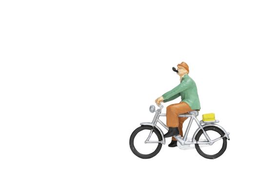 Miniature people travellers with bicycle isolate on white background with clipping path