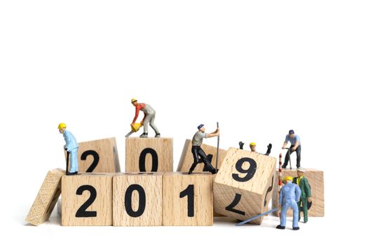 Miniature worker team painting number 2019 on white background , Happy new year 2019 concept