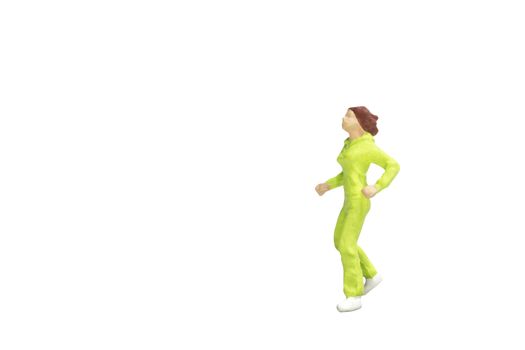 Miniature people running isolated on white background with clipping path
