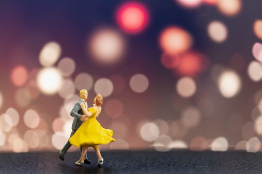 Miniature people , Couple dancing with bokeh background , Valentine's day concept