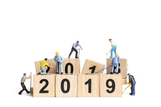 Miniature worker team building number 2019 on white background , Happy new year 2019 concept
