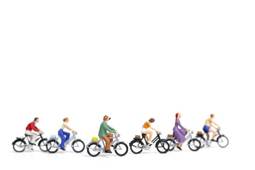 Miniature people : Friend Group ride bicycle  isolate on white background , Travel concept