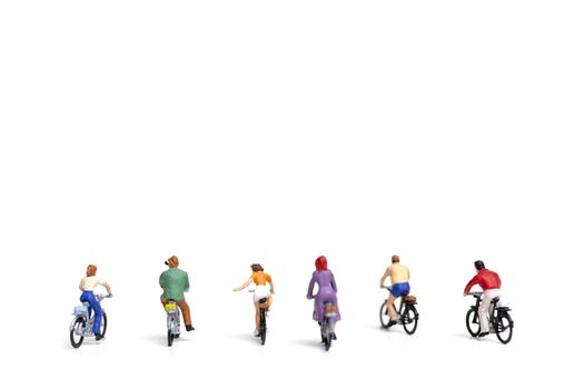 Miniature people : Friend Group ride bicycle  isolate on white background , Travel concept