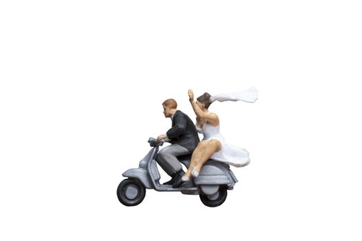 Miniature people : Couple riding the motorcycle on isolated on white background  with clipping path