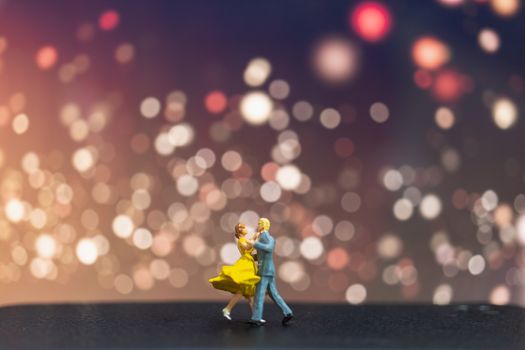 Miniature people , Couple dancing with bokeh background , Valentine's day concept