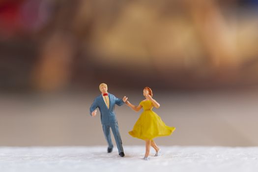 Miniature people , Couple dancing on the floor  , Valentine's day concept