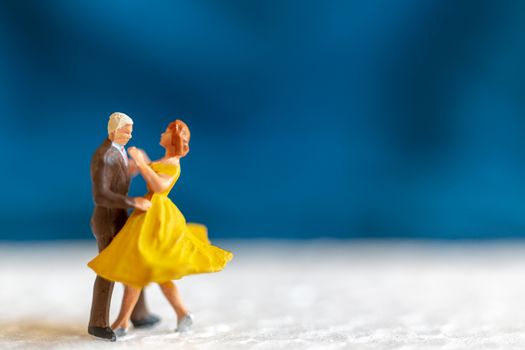 Miniature people , Couple dancing on the floor  , Valentine's day concept