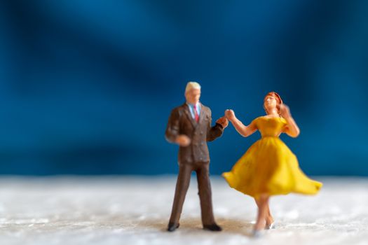 Miniature people , Couple dancing on the floor  , Valentine's day concept