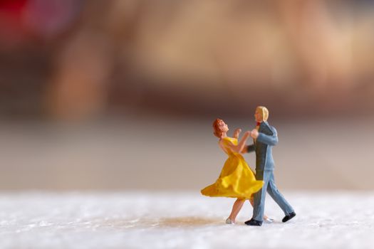 Miniature people , Couple dancing on the floor  , Valentine's day concept