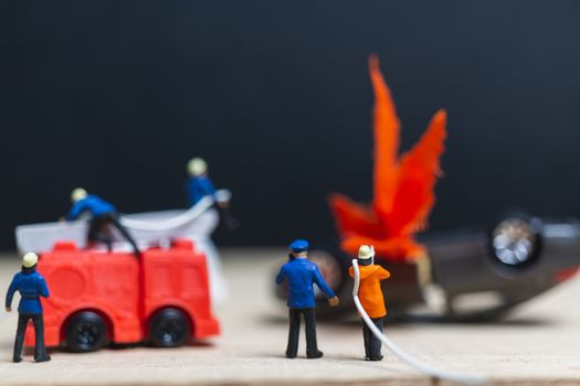 Miniature people : Firefighters at a car accident  , Cars on fire blow up