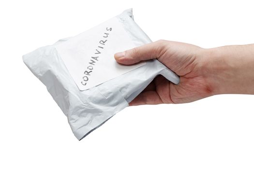 a hand holding small packet parcel from china with label coronavirus on it - isolated on white background.