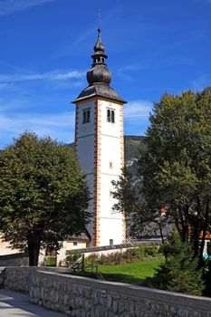 Church of St. John the Baptist and a bridge by the Bohinj lake, Slovenia