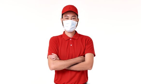 Asian delivery man wearing face mask in red uniform isolated over white background.