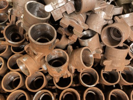 rusted metal parts close-up background with selective focus. improper factory storage issue