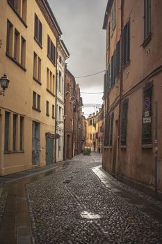 An historical empty alley in the historical city center of Ferrara in Italy