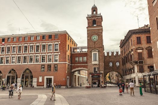 FERRARA, ITALY 29 JULY 2020 : Piazza del Municipio in Ferrara a famous square with clock tower