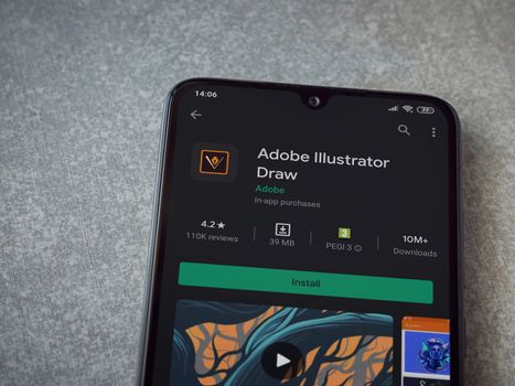 Lod, Israel - July 8, 2020: Adobe Illustrator Draw app play store page on the display of a black mobile smartphone on ceramic stone background. Top view flat lay with copy space.