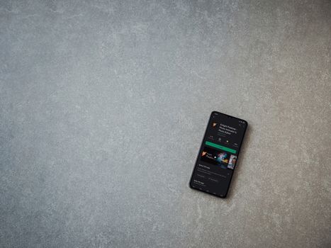 Lod, Israel - July 8, 2020: Enlight Pixaloop app play store page on the display of a black mobile smartphone on ceramic stone background. Top view flat lay with copy space.