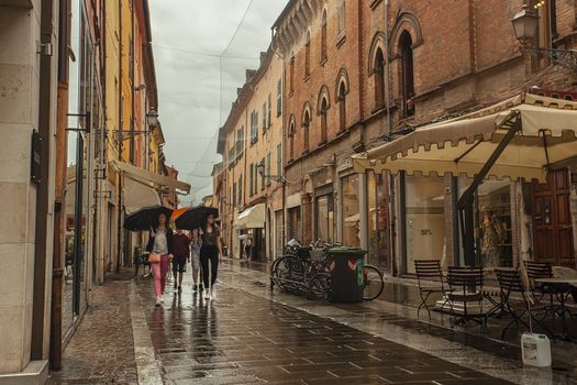 FERRARA, ITALY 29 JULY 2020 : Evocative view of a street in the historic center of Ferrara, an Italian city