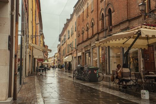 FERRARA, ITALY 29 JULY 2020 : Evocative view of a street in the historic center of Ferrara, an Italian city