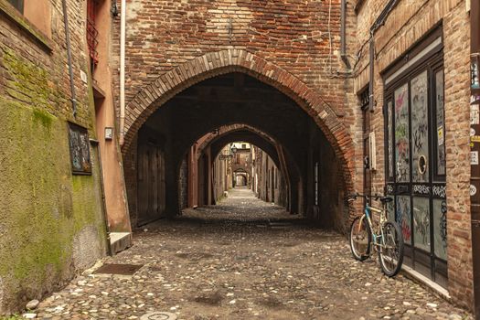 FERRARA, ITALY 29 JULY 2020 : Via delle Volte in Ferrara in Italy a famous alley in the Historical italian city