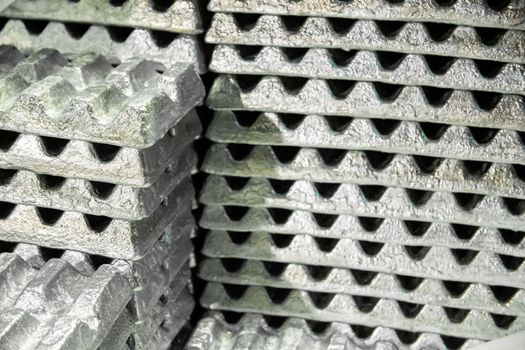 stack of aluminium ingots - close-up with selective focus,