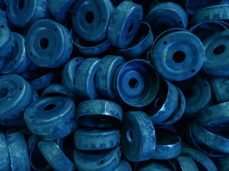 a pile of dirty black stamped metal round shells after a hood operation - - classic blue color toned