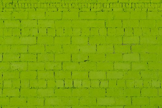 green plaster rough brick wall texture under direct sunlight