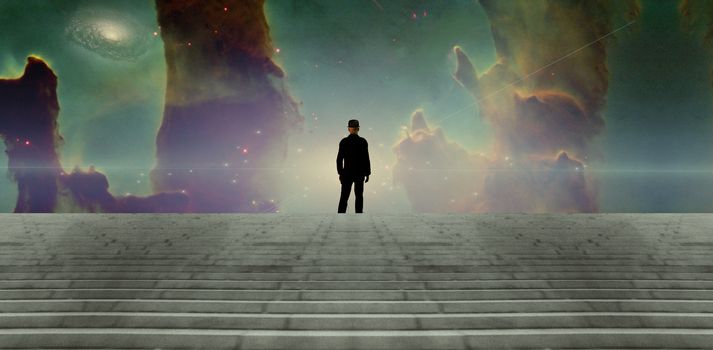 Surreal scene. Man in black suit. Nebula and galaxy in the sky