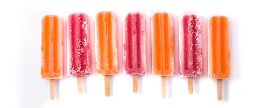 Orange and strawberry popsicles isolated on white background.