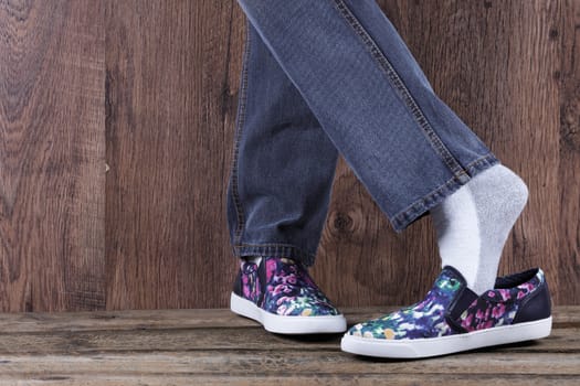 Casual concept, pumps and jeans on a wood background