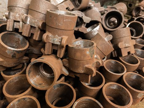 rusted metal parts close-up background with selective focus. improper factory storage issue