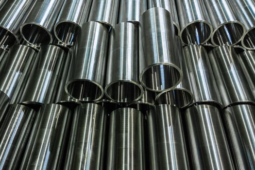 unadorned photo of cnc turned shiny steel pipes.