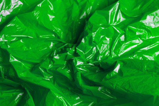 crumpled polyethilene film abstract background with selective focus.