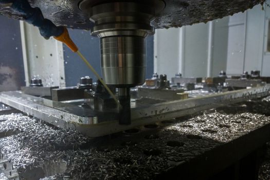 A process of cnc contour side milling of lagre thick steel palte, Selective focus with blur technique.