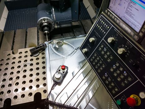 Measuring process with ruby touch probe on large CNC milling machine in jog mode.