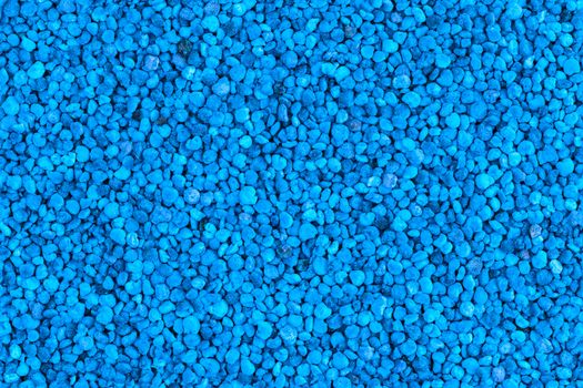 seamless flat texture and background of blue toned granules of bee pollen.