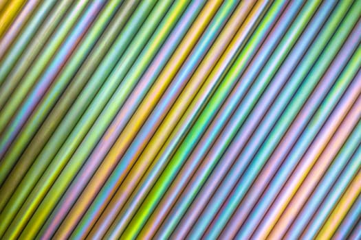 An abstract lines backround of colorful cadmium coated steel bars. Industrial grade chemical protective coating for metal parts.