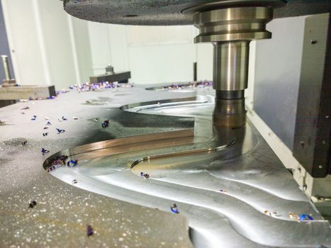 A process of cnc milling of lagre thick steel palte by curved trajectory, Selective focus with blur technique